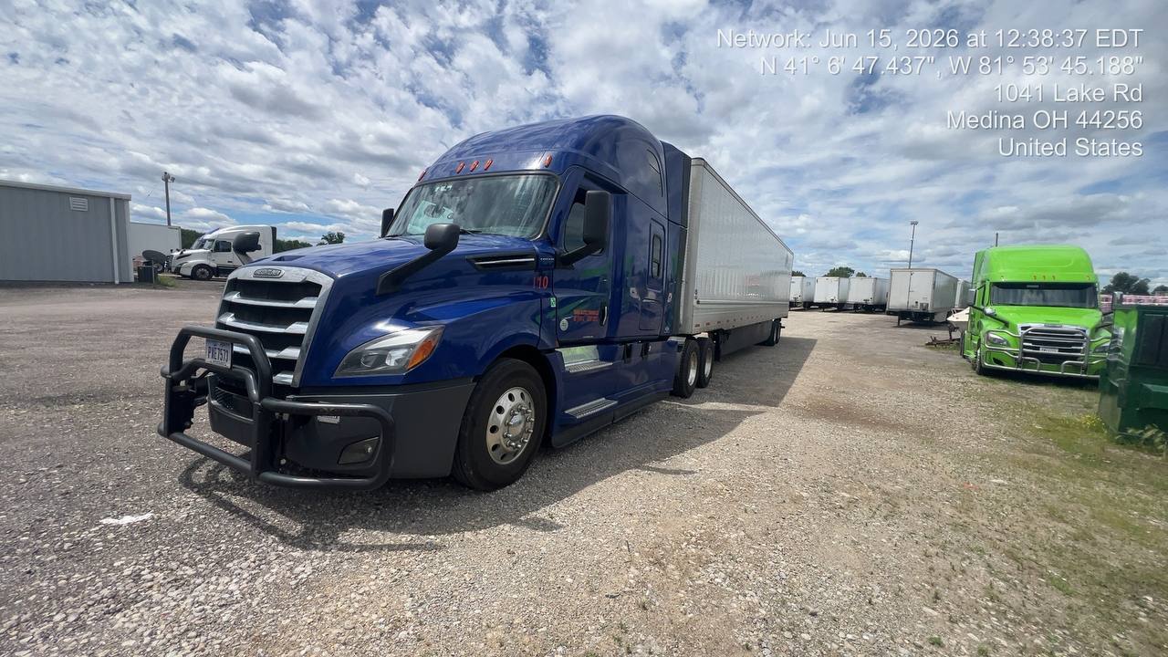 Blue Freightliner and trailer at the MKZ yard